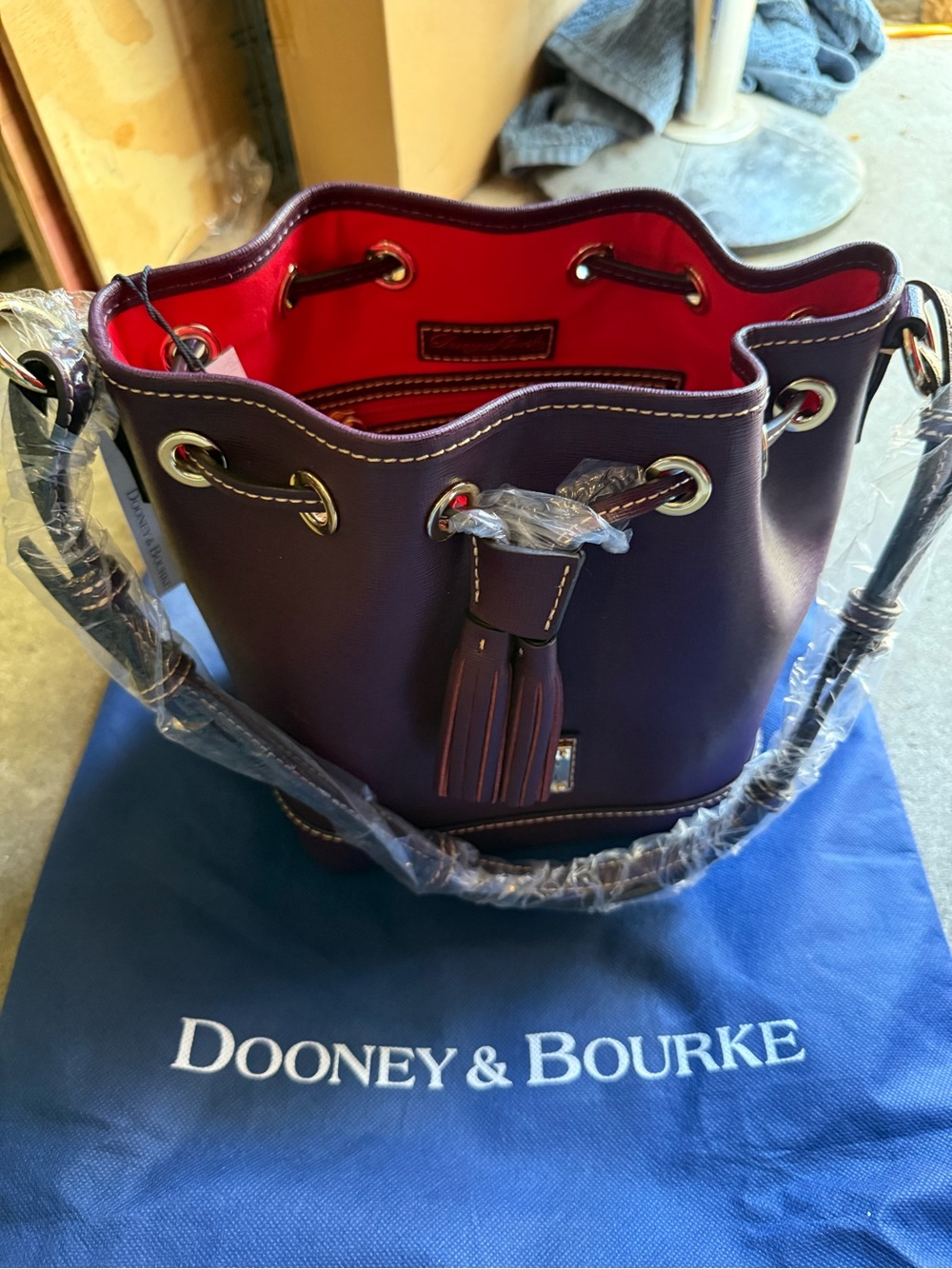 Brand new Dooney & Bourke Plum Wine Bucket Drawstring Bag w/Dust Bag,Red Lined